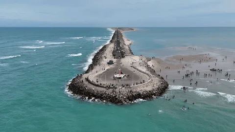 10 Hidden Gems in India Every Traveler Must Visit once Aerial view of Dhanushkodi beach in Tamil Nadu where the Bay of Bengal meets the Indian Ocean, with a narrow land strip and surrounding blue waters